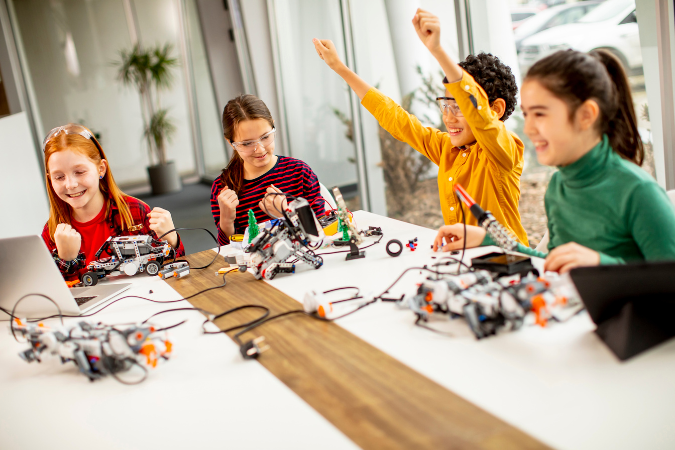Happy Kids Programming Electric Toys and Robots at Robotics Clas